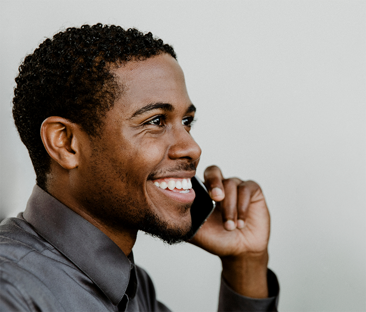 Bearded man talking on cell phone