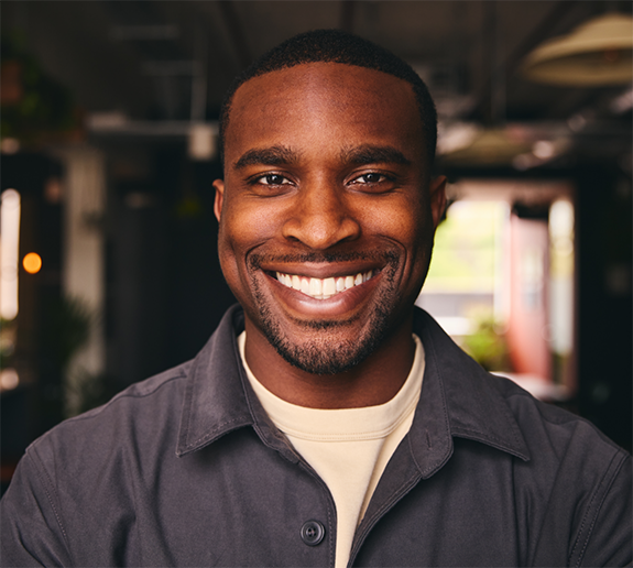 Smiling man with facial hair and jacket