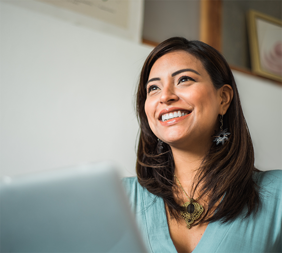 Woman sitting at laptop