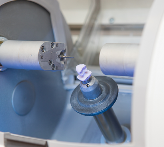 Close up of ceramic block in CEREC machine