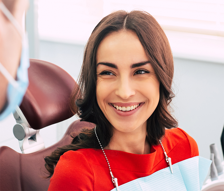 Female dental patient in red shirt