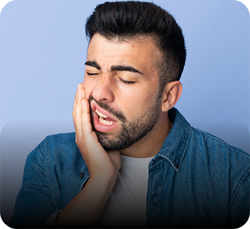 Man with beard rubbing his jaw