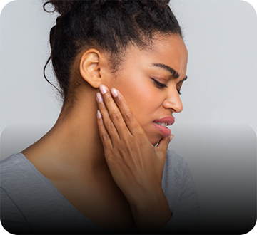 Close up of woman rubbing her jaw